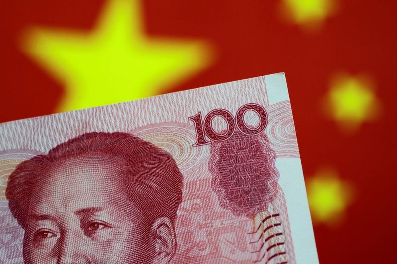 © Reuters. FILE PHOTO: A China yuan note is seen in this illustration photo May 31, 2017.     REUTERS/Thomas White/Illustration/File Photo